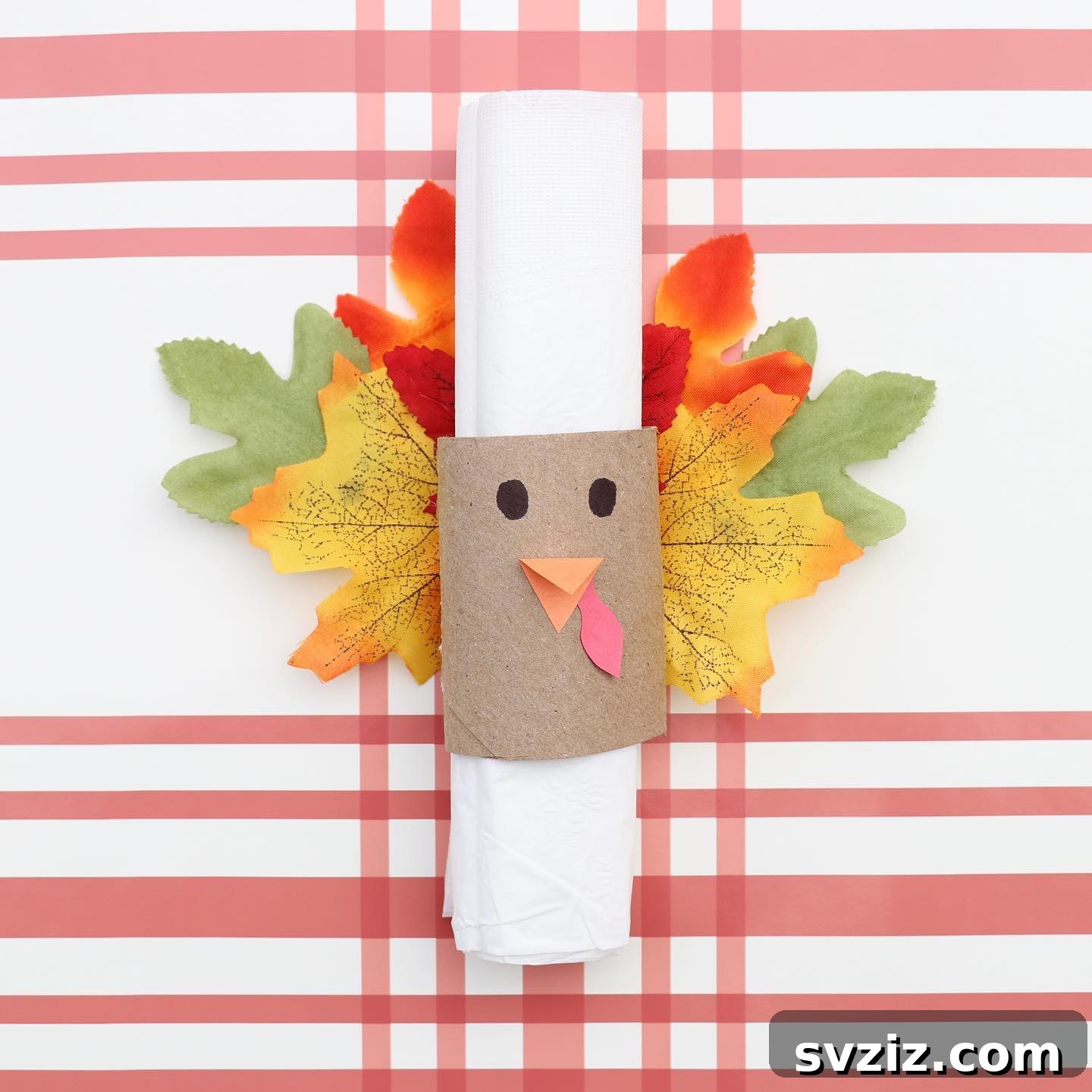 Craft the Perfect Feast: 21 DIY Thanksgiving Tablescapes 7 Cute DIY turkey napkin rings made with craft supplies and fall leaves, perfect for a family-friendly Thanksgiving tablescape.