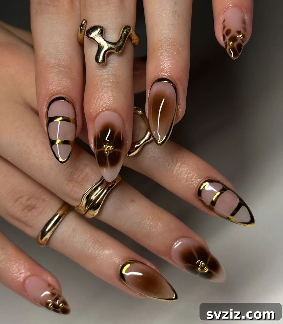 Chic Autumn Almond Nail Ideas 15 Luxurious gold chrome almond nails, an ideal choice for elegant fall events and special occasions