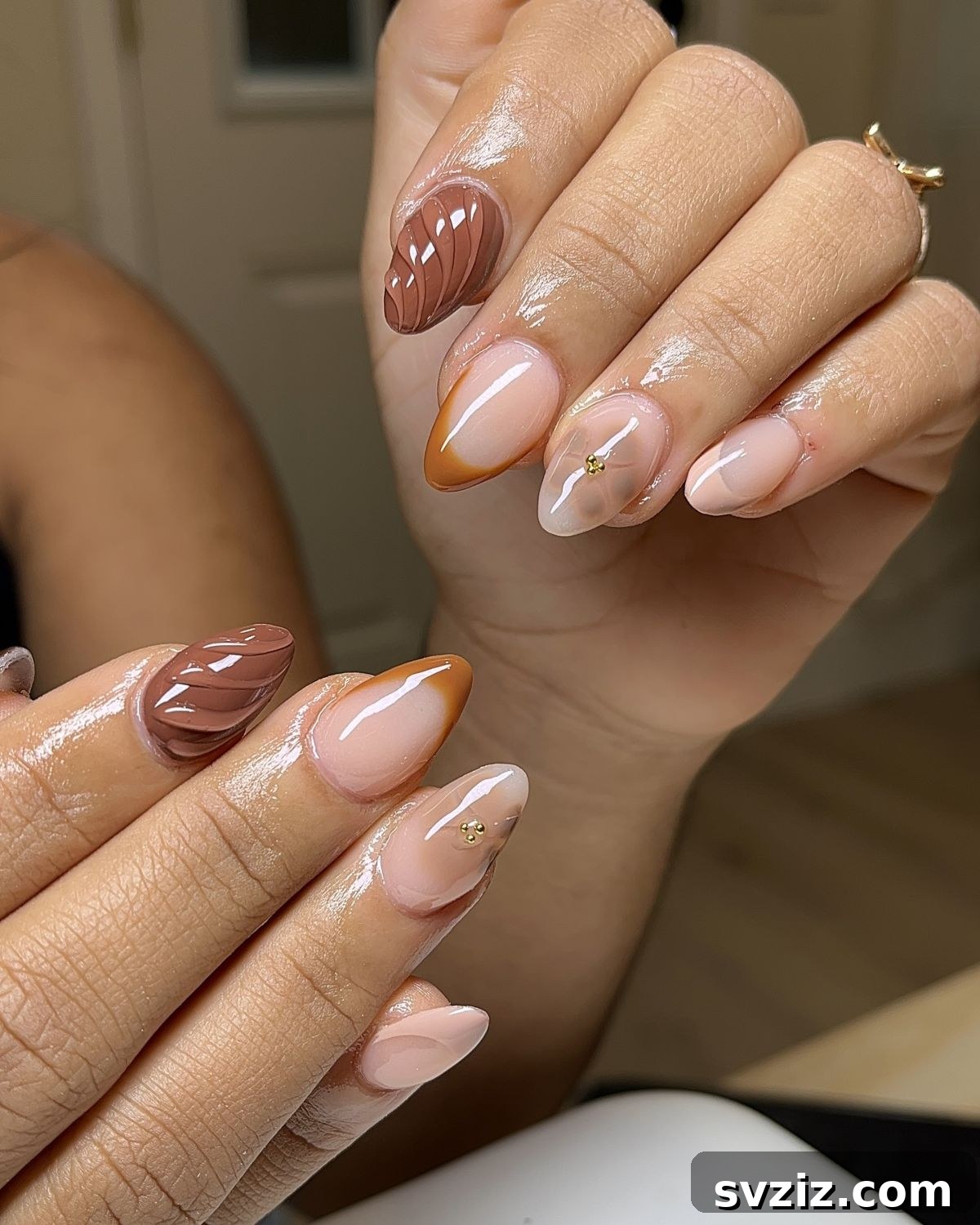 Chic Autumn Almond Nail Ideas 18 Understated mix and match almond fall nails with eye-catching brown and orange accents on a sophisticated nude base