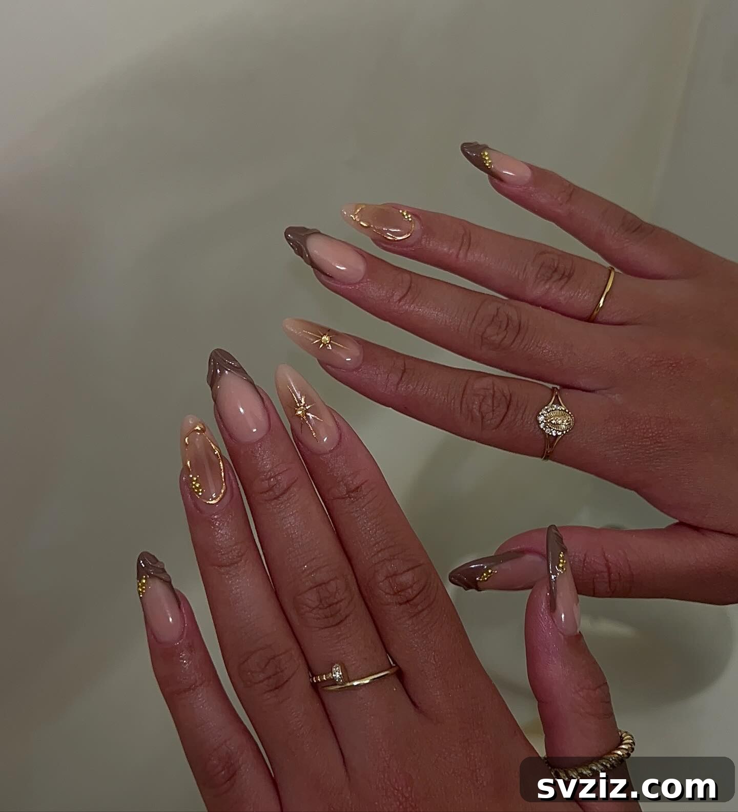 Chic Autumn Almond Nail Ideas 4 Glamorous almond fall manicure with dazzling gold accents and sophisticated textured designs