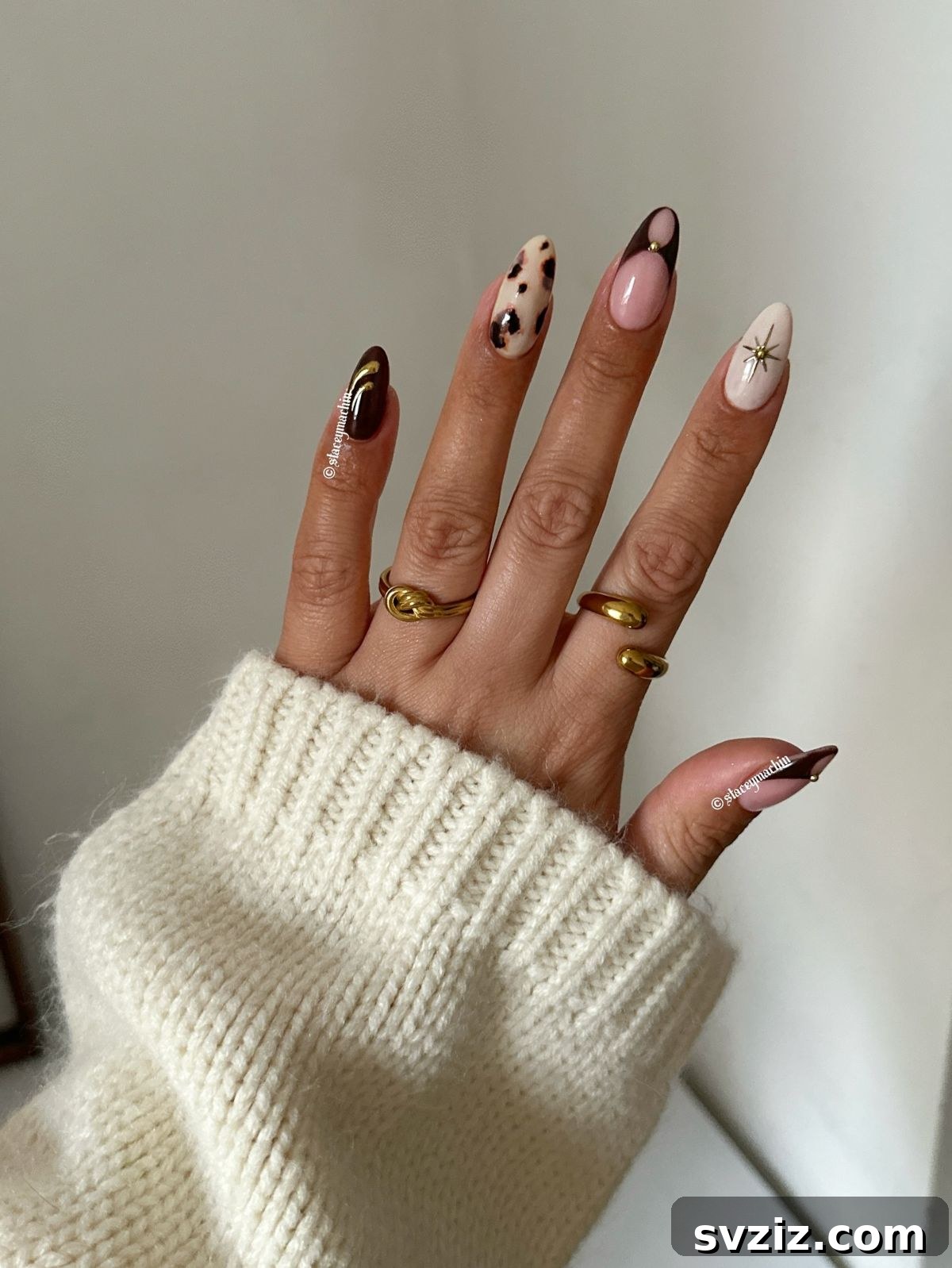 Chic Autumn Almond Nail Ideas 7 Chic mix and match almond nails showcasing classic fall colors like brown and nude pink with varied patterns