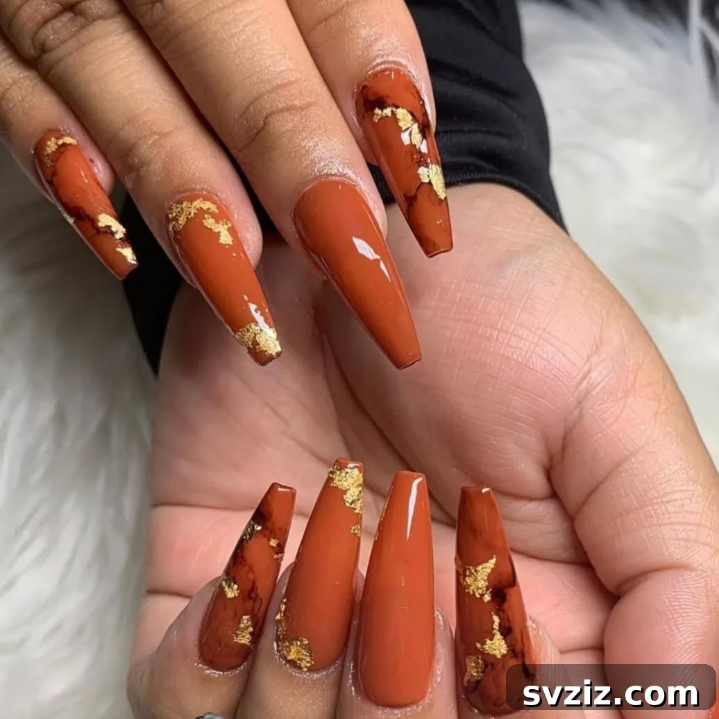 Get Festive Fingers: 21 Adorable Thanksgiving Nail Ideas 13 Radiant Orange and Gold Thanksgiving Nails