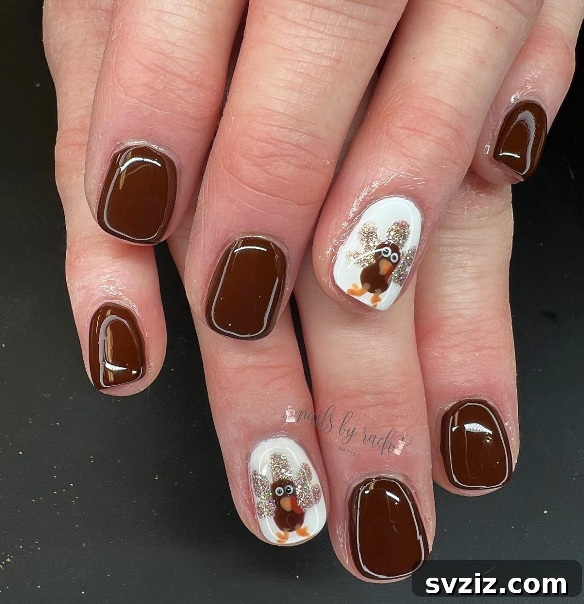 Get Festive Fingers: 21 Adorable Thanksgiving Nail Ideas 5 Chocolate Brown Thanksgiving Nails with Turkey Accent