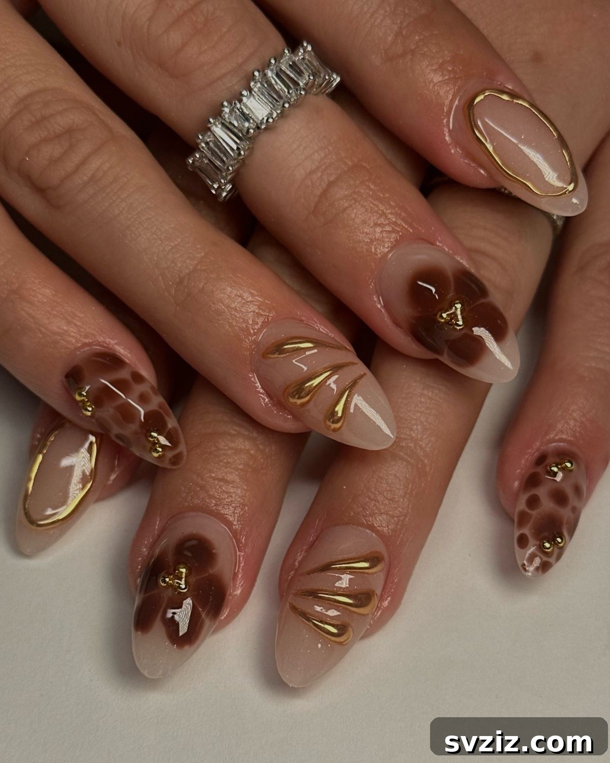 21 Exquisite Almond Nail Designs for Thanksgiving 6 4. Glitzy Brown and Gold Nail Art for Thanksgiving