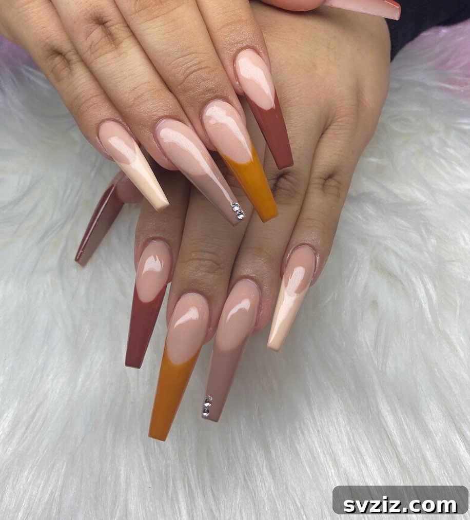 Stunning Thanksgiving Acrylic Nail Art for the Holiday Season 15 Long and lovely Fall French acrylic nails with colorful tips in gorgeous autumnal hues, perfect for a chic Thanksgiving.