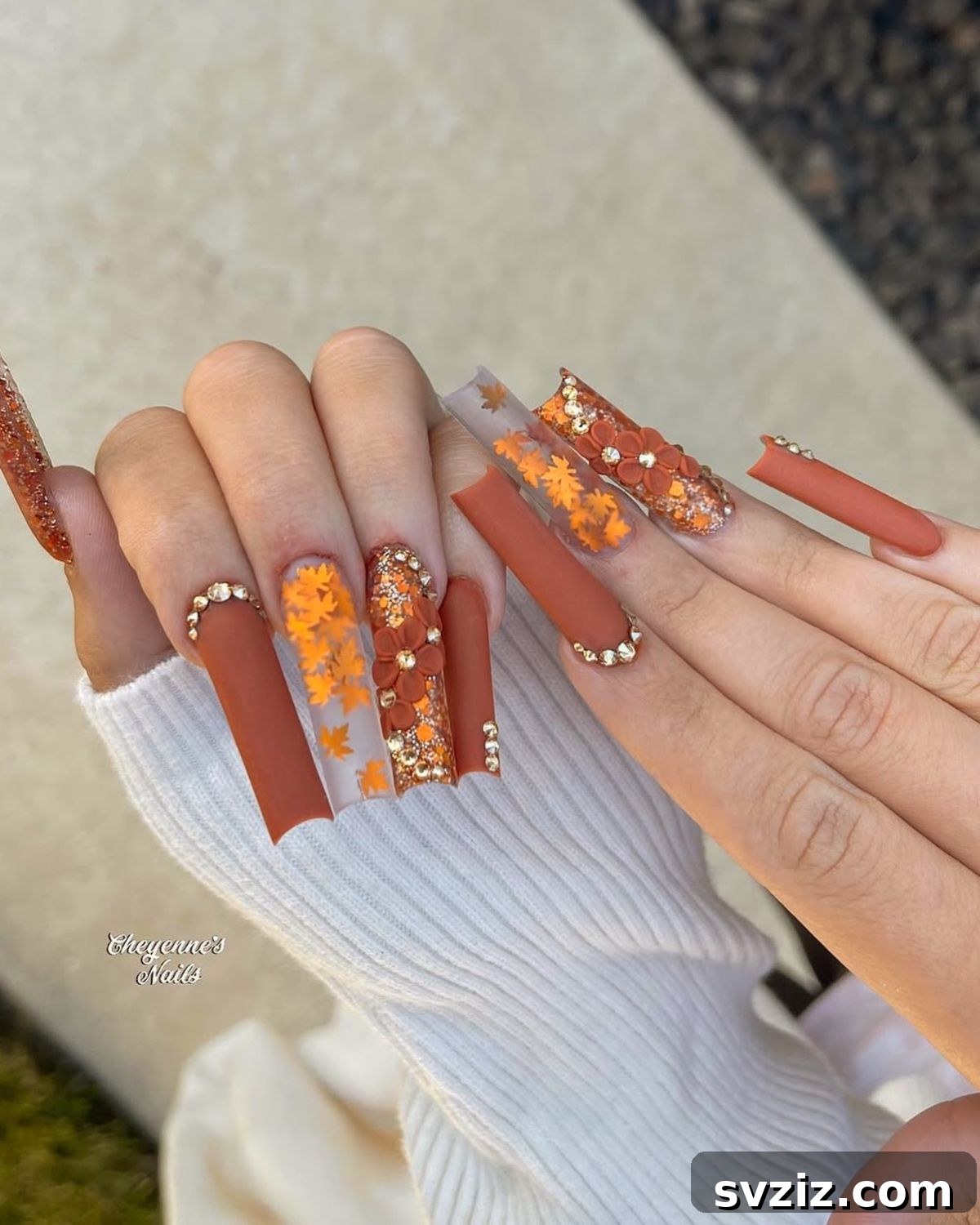 Stunning Thanksgiving Acrylic Nail Art for the Holiday Season 18 Festive Thanksgiving acrylics combining orange autumn leaves, elegant fall florals, rich matte brown polish, and nail rhinestones.