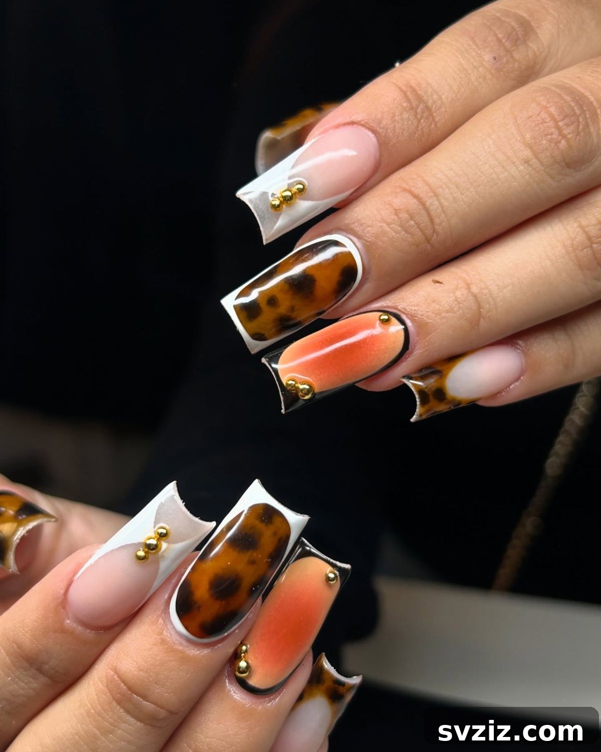 Stunning Thanksgiving Acrylic Nail Art for the Holiday Season 22 Incredible square Thanksgiving acrylic nails featuring tortoiseshell accents, glamorous rhinestones, and orange splashes for a funky vibe.