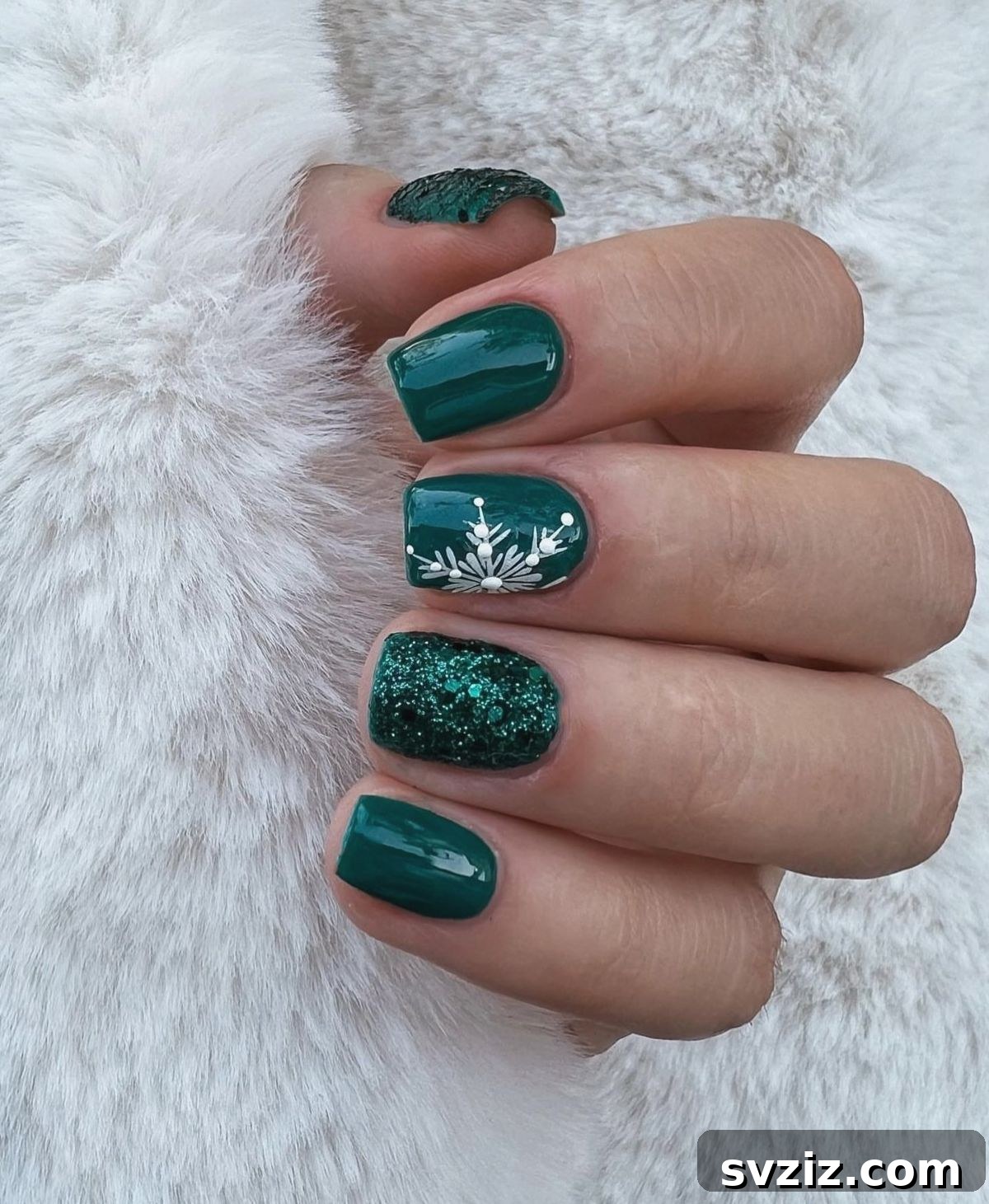 8. Pretty and Sparkly Green Christmas Nails