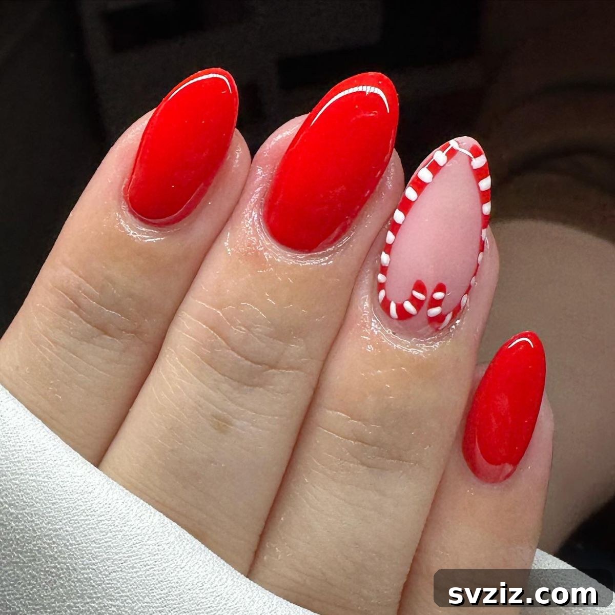 Festive Red Christmas Nail Art Ideas to Inspire Your Holiday Look 16 14. Minimalist Candy Cane Manicure