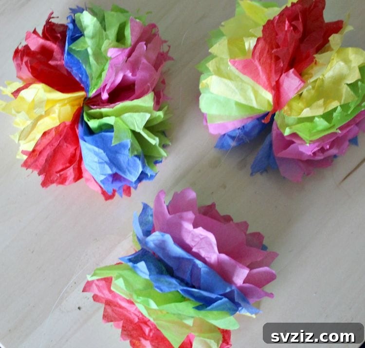 53 Paper Craft Ideas to Spark Your Imagination 16 Colorful hanging paper flowers for decor