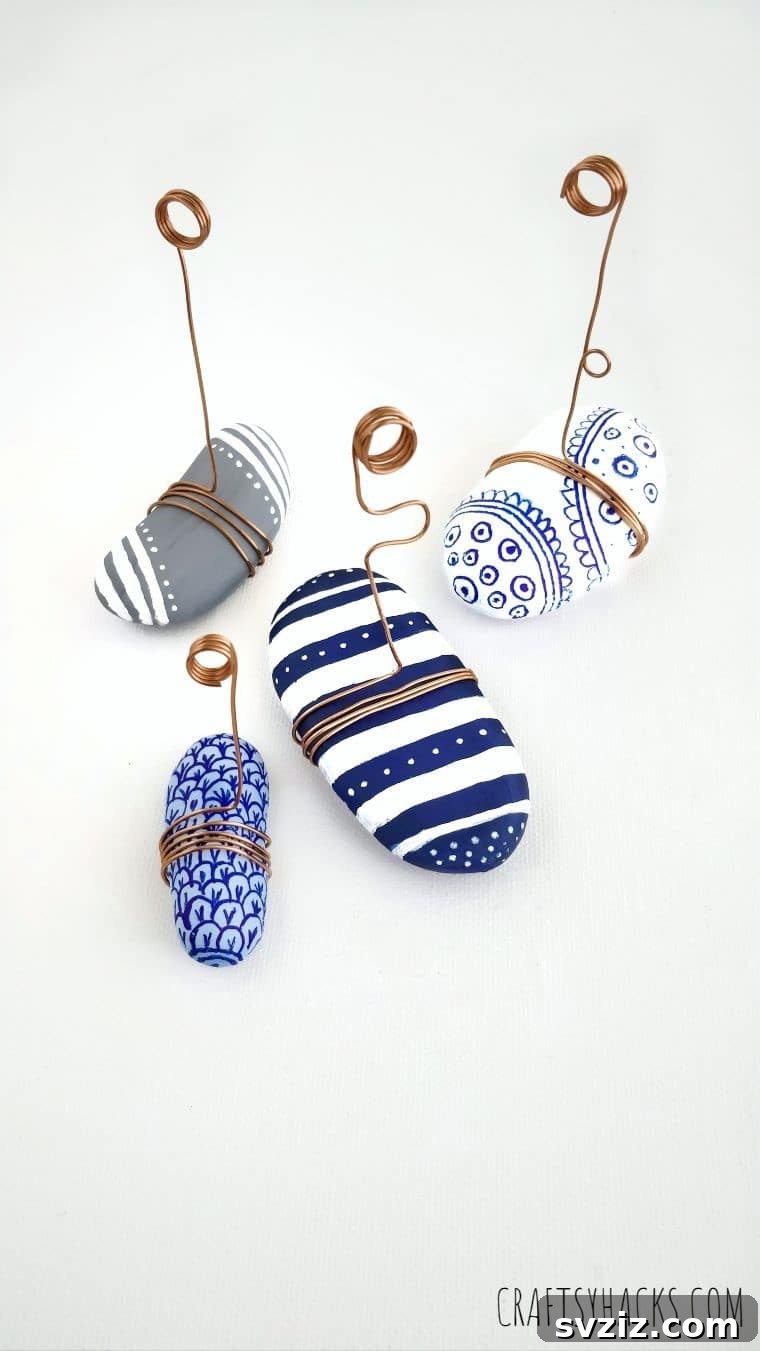 Collection of beautifully painted rock photo holders with creative wire designs