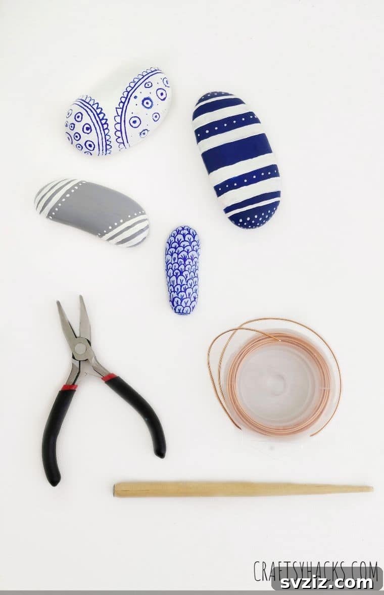 Supplies arranged, including decorated rocks and copper wire