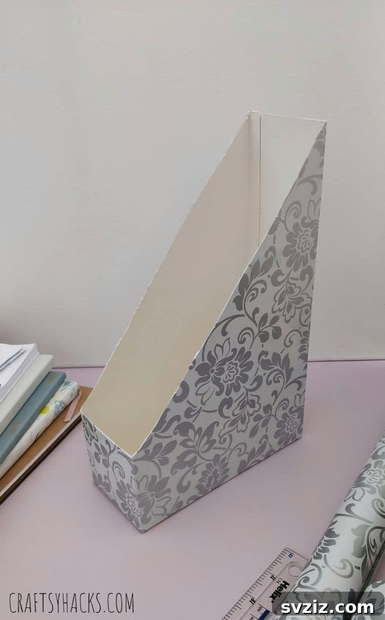 Completed DIY desk organizer, neatly holding magazines and papers, enhancing the home office aesthetic