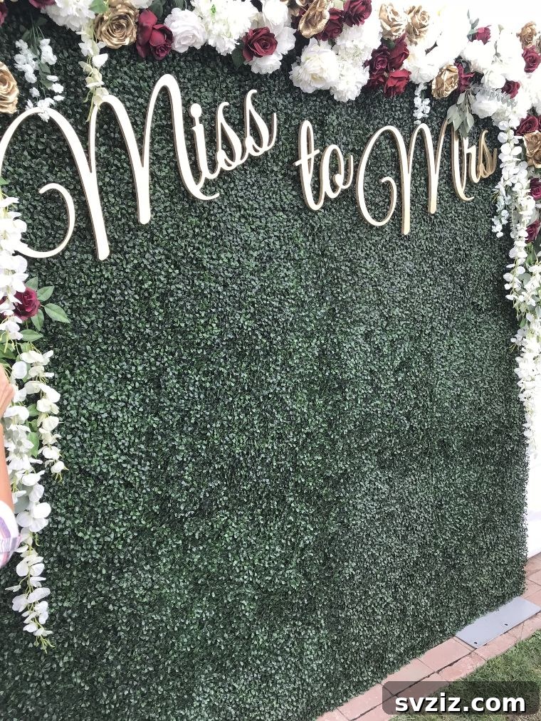 Lush Faux Green Wall for Wedding Decor with Custom Signage