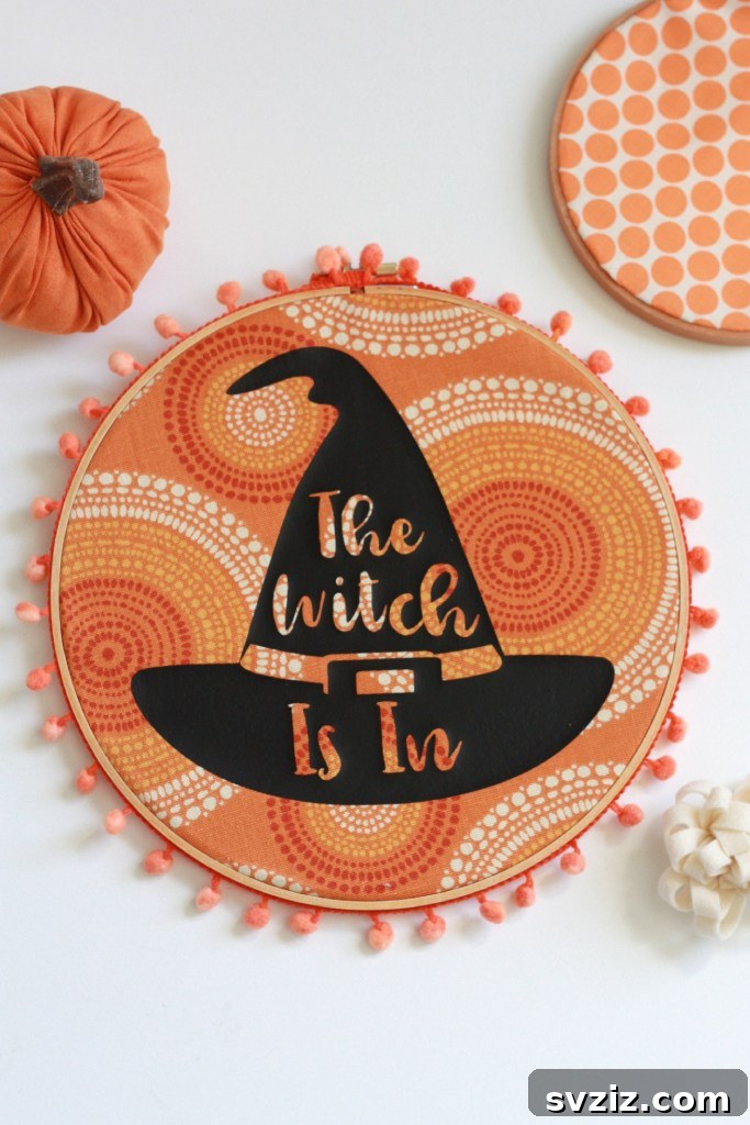 20 Spooktacular Halloween Decorating Ideas 11 Witch Hat Stencil Wall Decor using Cricut Machine