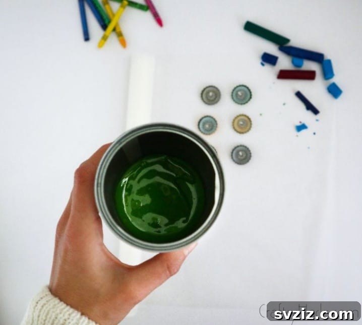 Bottle Cap Tealight Creations 11 Melted green crayon wax inside a metal can, ready for pouring.