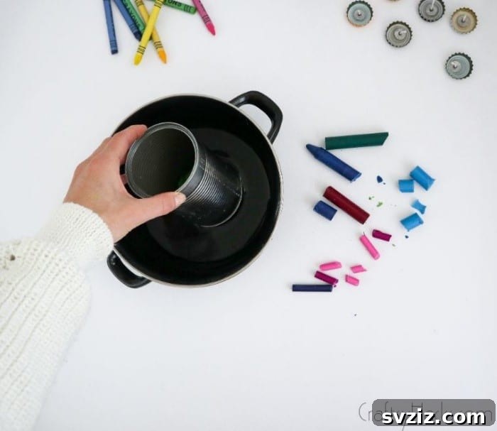 Bottle Cap Tealight Creations 10 A metal can with crayons placed inside a saucepan with water, illustrating the double boiler method.