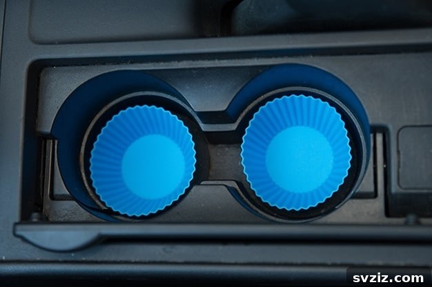 Zero-Effort Shine: 11 Lazy Car Cleaning Hacks 11 Silicone cupcake liners placed in car cup holders