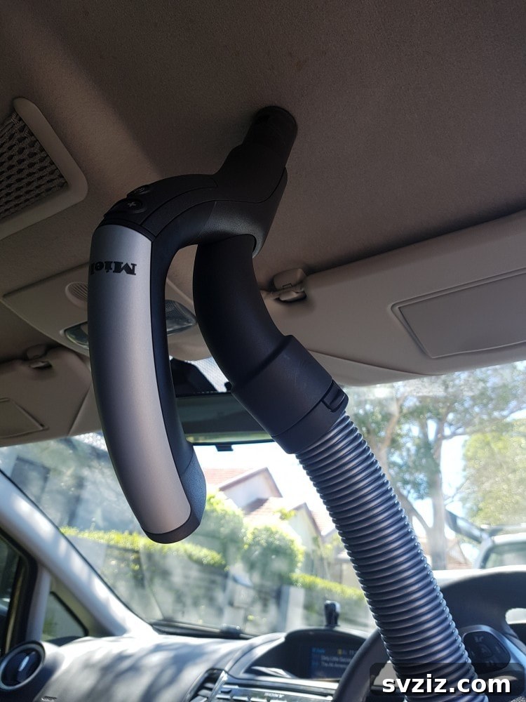 Zero-Effort Shine: 11 Lazy Car Cleaning Hacks 5 Vacuuming the interior roof of a car