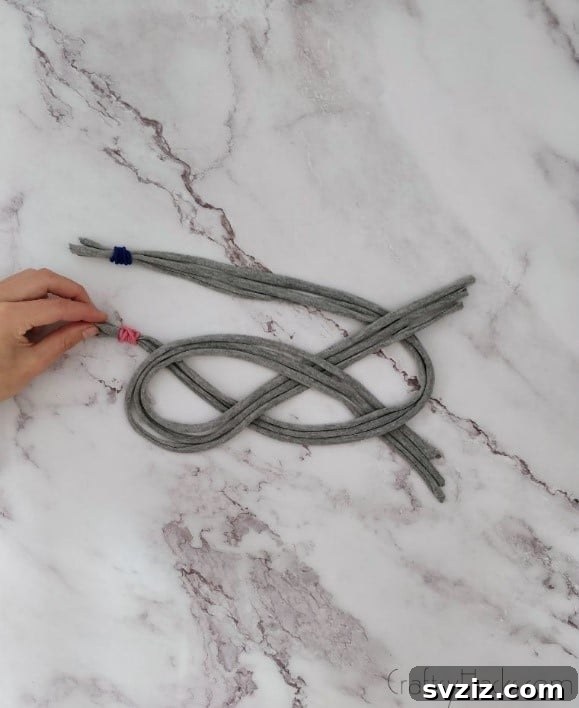 pulling pink elastic under loop