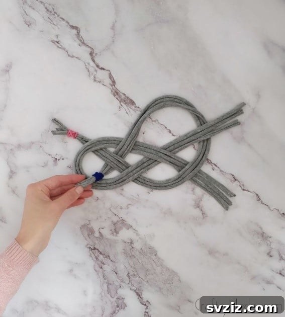 pulling blue elastic through bottom loop