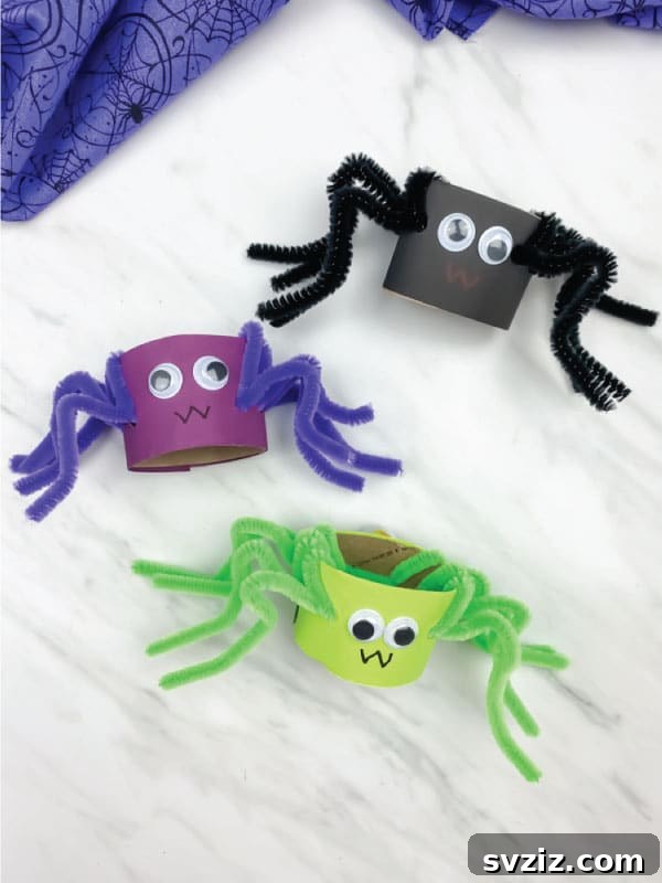 Spin a Web of Wonder: Spider Crafts for Your Little Bug Enthusiast 3 Adorable toilet paper roll spiders crafted with pipe cleaners and googly eyes, perfect for an easy kids' activity.