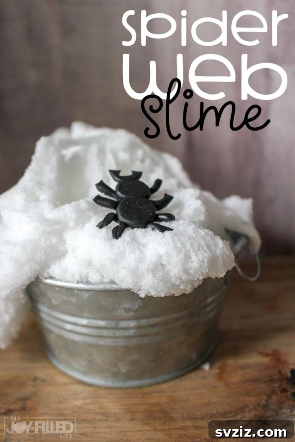Spin a Web of Wonder: Spider Crafts for Your Little Bug Enthusiast 22 Green slime with small spider web details and plastic spiders, an exciting sensory project for kids.