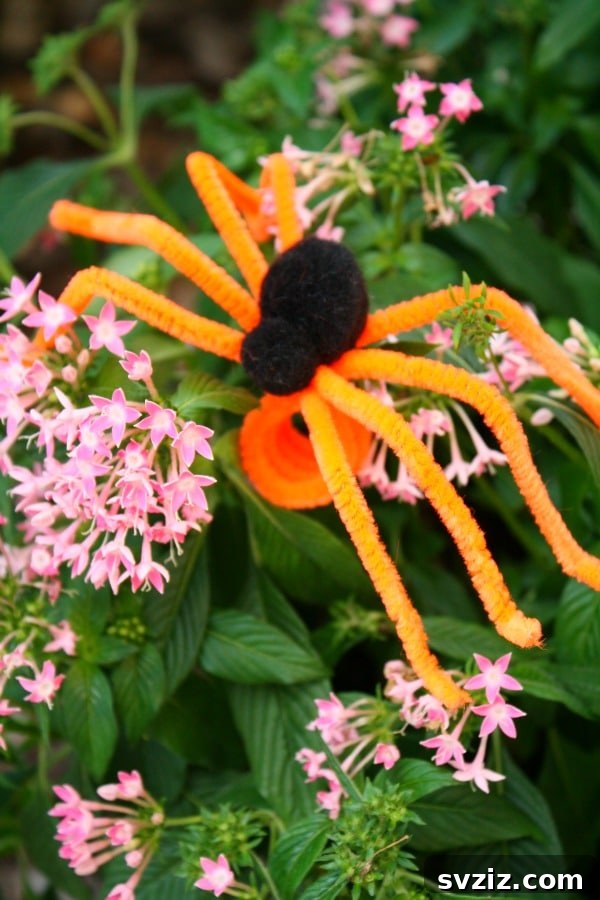 Spin a Web of Wonder: Spider Crafts for Your Little Bug Enthusiast 26 A simple and colorful spider ring made from pipe cleaners, a fun accessory for kids.