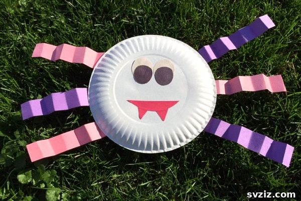 Spin a Web of Wonder: Spider Crafts for Your Little Bug Enthusiast 7 A cheerful paper plate spider craft, perfect for teaching children about spiders with a friendly approach.