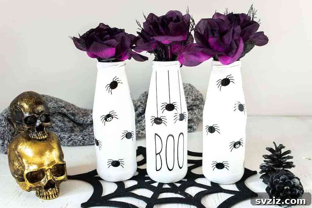 Spin a Web of Wonder: Spider Crafts for Your Little Bug Enthusiast 9 Elegant upcycled glass vases decorated with black spider silhouettes, perfect for Halloween or fall decor.