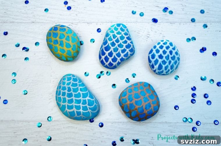 18 Magical Mermaid DIY Projects for Little Ariel Enthusiasts 12 Beautiful Mermaid Scale Painted Rocks featuring shimmering gradient colors and intricate scale patterns.