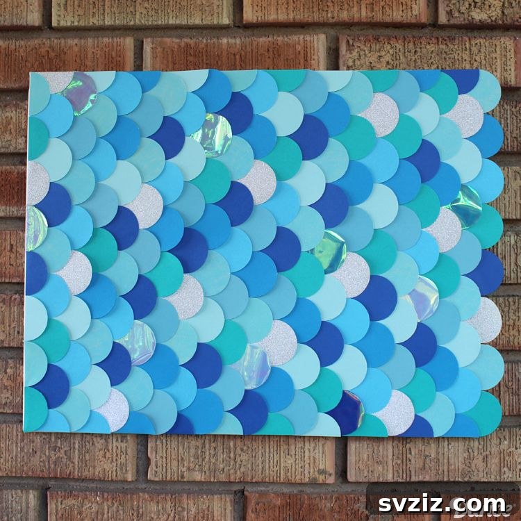 18 Magical Mermaid DIY Projects for Little Ariel Enthusiasts 16 Modern Mermaid Wall Art featuring shimmering DIY fish scales in blue and silver, ideal for a kid's bedroom.