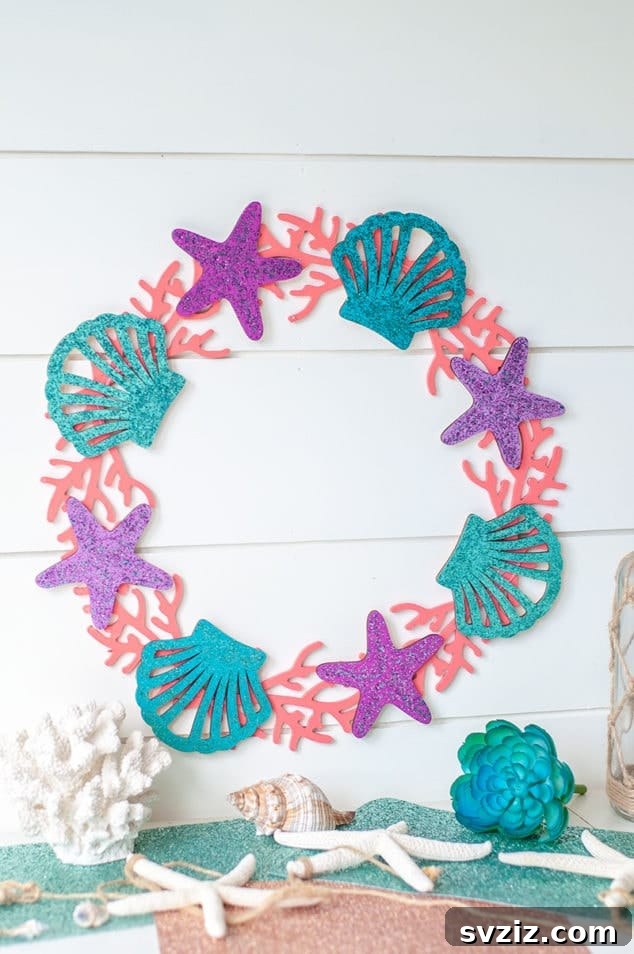 18 Magical Mermaid DIY Projects for Little Ariel Enthusiasts 17 A dazzling Galaxy Glitter Mermaid Wreath, adorned with shells and glitter, perfect as a year-round door decoration.
