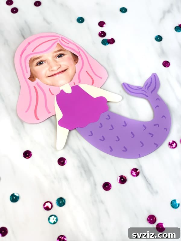 18 Magical Mermaid DIY Projects for Little Ariel Enthusiasts 4 A cute Mermaid Photo Craft showing a child's photo head on a vibrant paper mermaid body, perfect for personalized art.