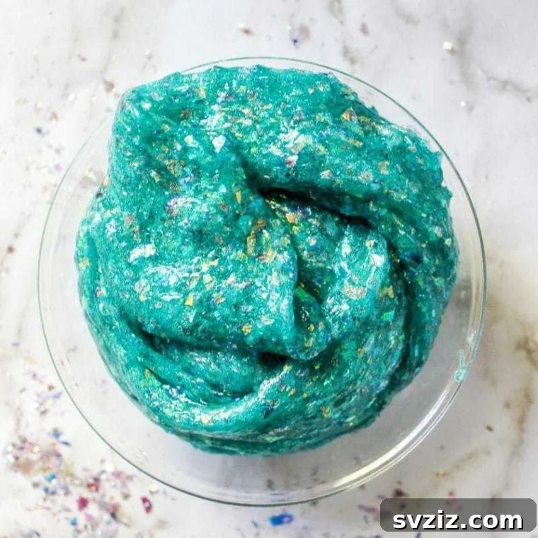 18 Magical Mermaid DIY Projects for Little Ariel Enthusiasts 9 Vibrant Sparkly Mermaid Slime in shades of blue and purple with glitter, a fun and tactile craft for kids.