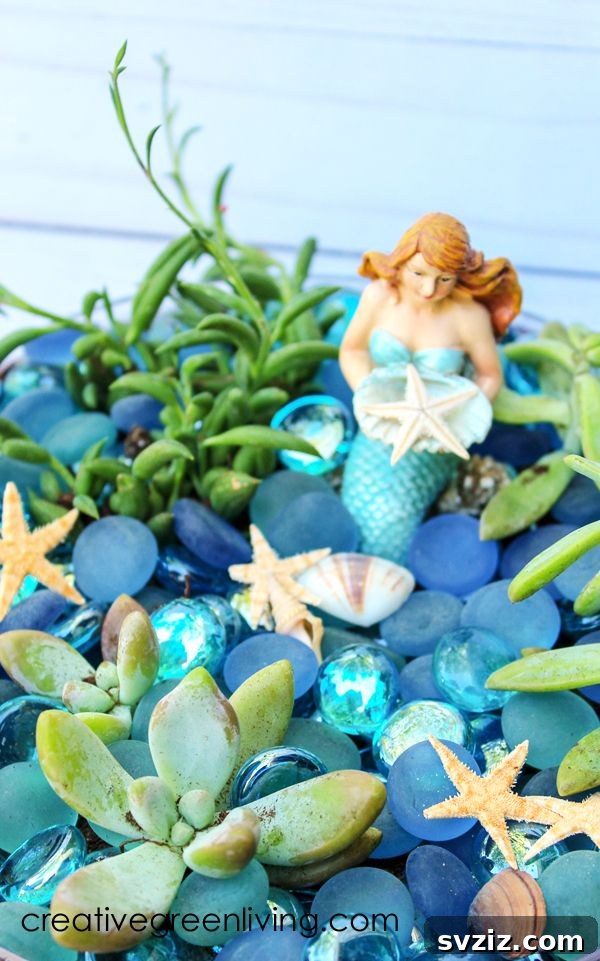 18 Magical Mermaid DIY Projects for Little Ariel Enthusiasts 10 A charming Mermaid Succulent Garden in a clear terrarium, decorated with mermaid figurines and ocean elements.