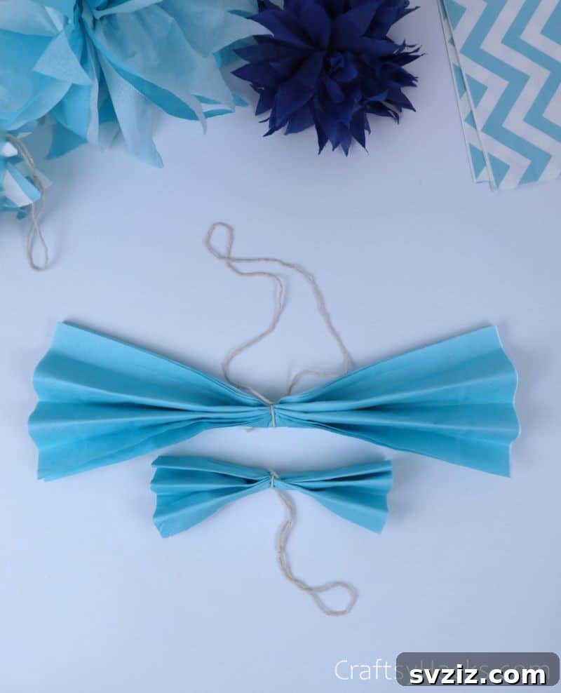 light blue tissue with string tied around