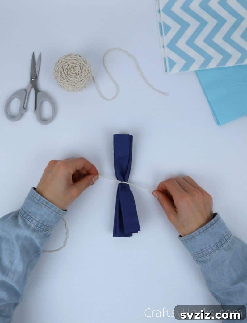 tying string around tissue paper