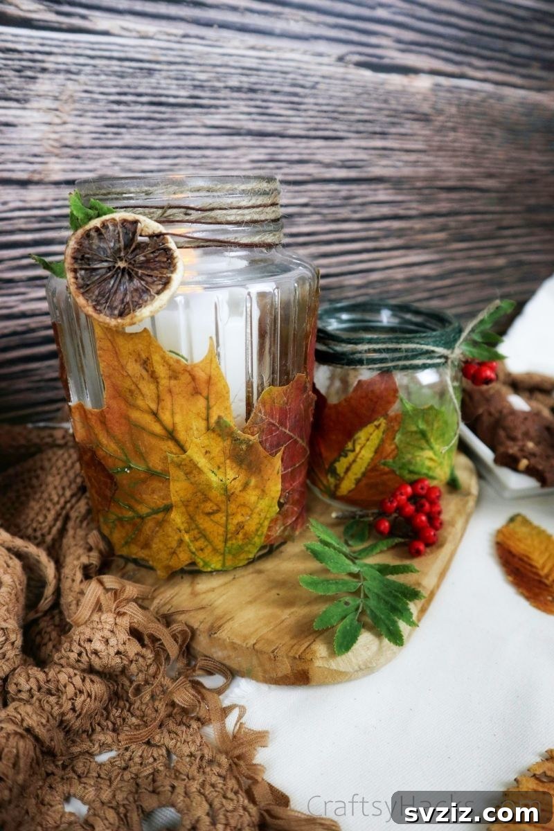 A charming display of several fall leaf candle holders arranged as a centerpiece, showcasing various leaf colors and decorative accents.