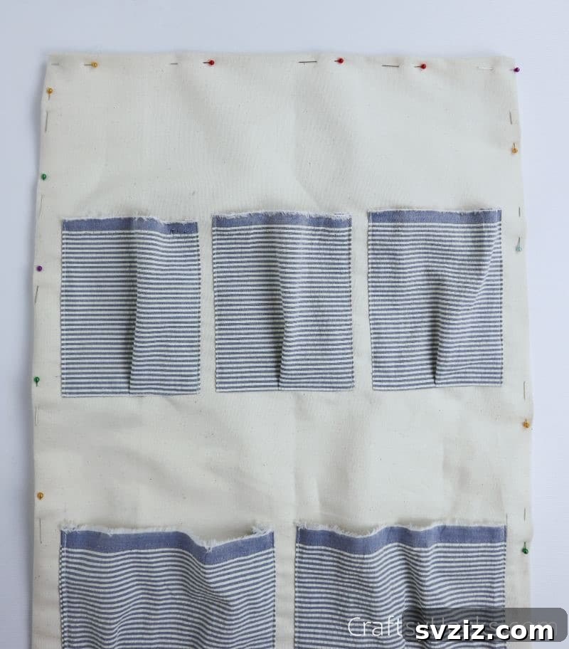 The pinned border of the main fabric organizer, ready for final hemming