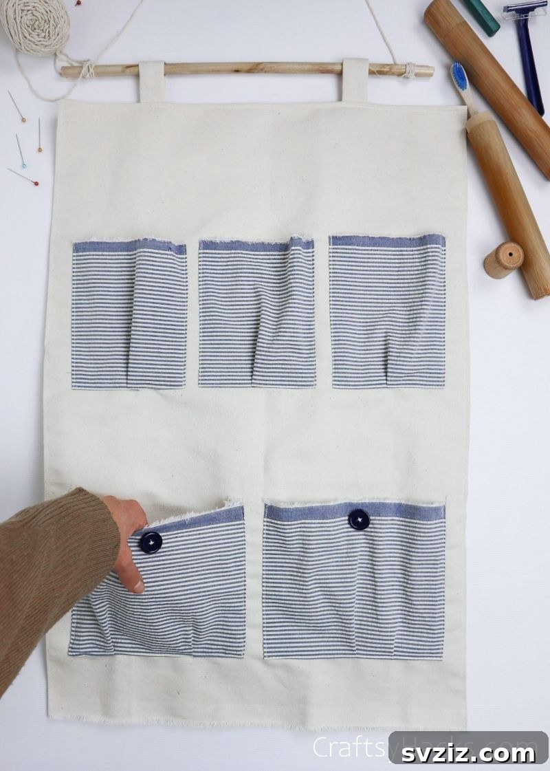 Close-up of a DIY fabric organizer with various patterned pockets