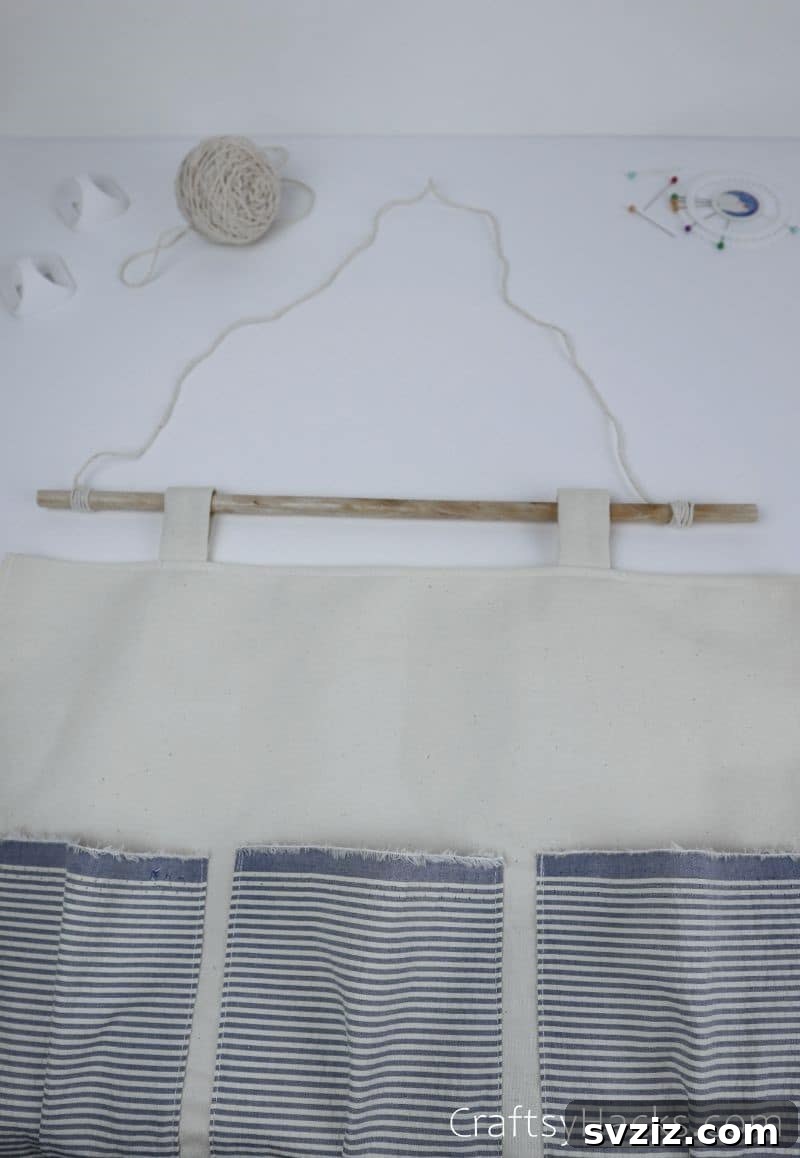 The hanging organizer displayed with a string attached for hanging