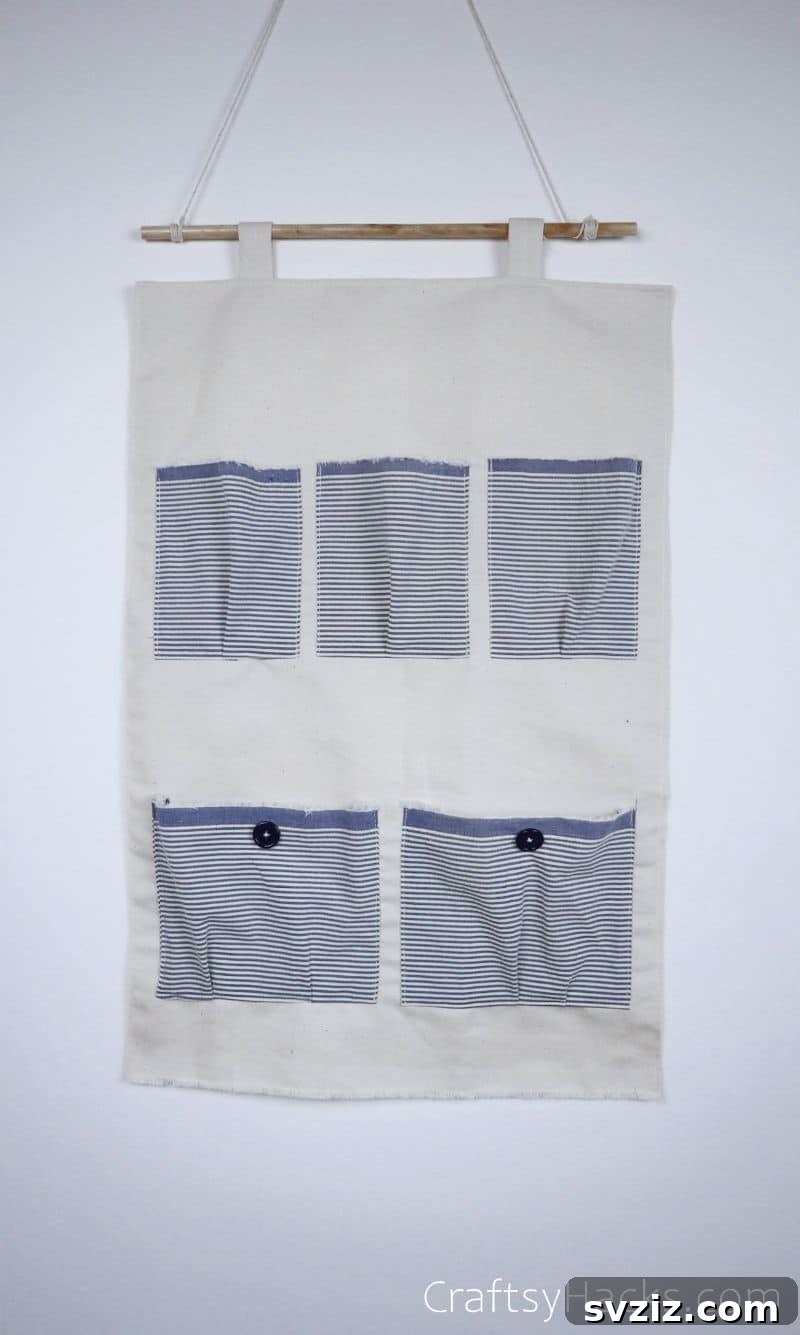 A finished pocket organizer, hanging neatly on a wall