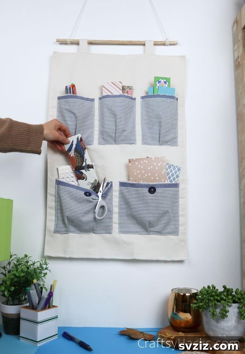 DIY pocket organizer filled with various items like stationery and small plants