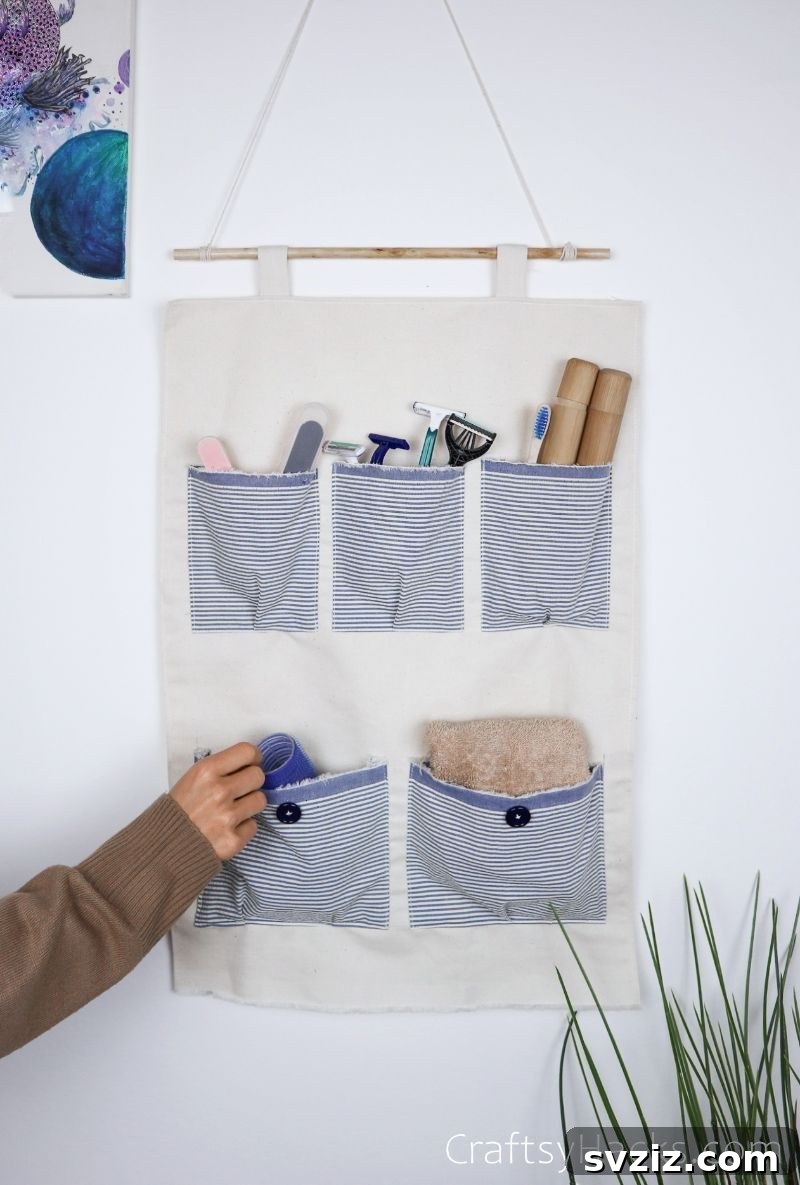 The DIY fabric organizer hanging elegantly on a wall in a kitchen setting