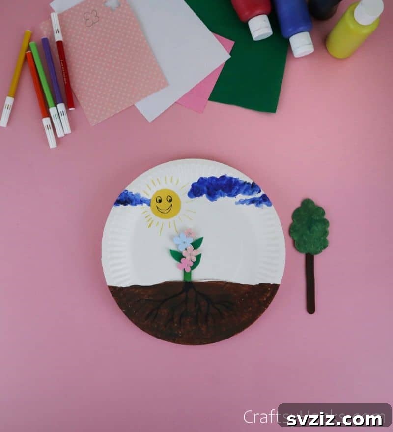 flower on paper plate craft with stick inserted