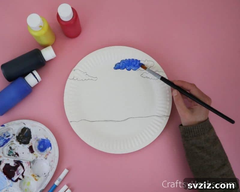 painting clouds on paper plate for kids craft