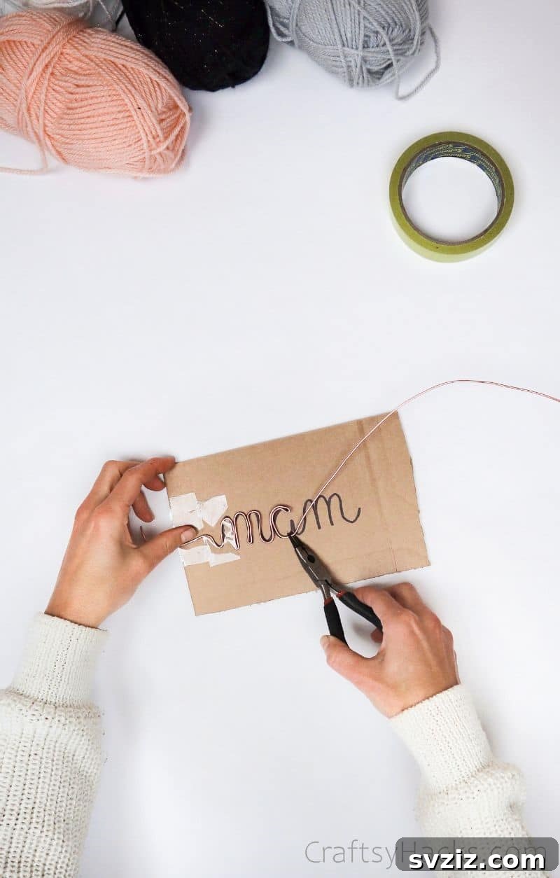 Stunning Wire Ornaments: Handmade Gifts You'll Adore 7 Tracing wire over a cursive name written on cardboard