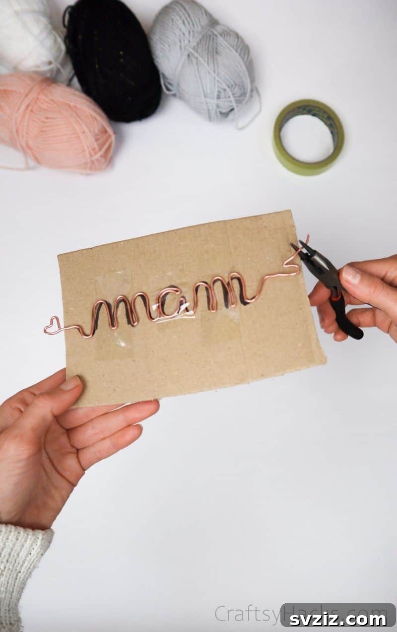 Stunning Wire Ornaments: Handmade Gifts You'll Adore 8 Bending wire with pliers to spell a name on cardboard template