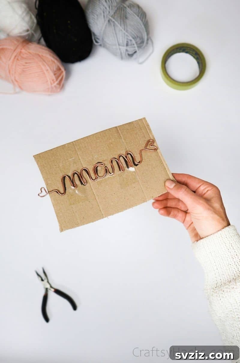 Stunning Wire Ornaments: Handmade Gifts You'll Adore 9 A finished wire name, shaped and ready for wrapping